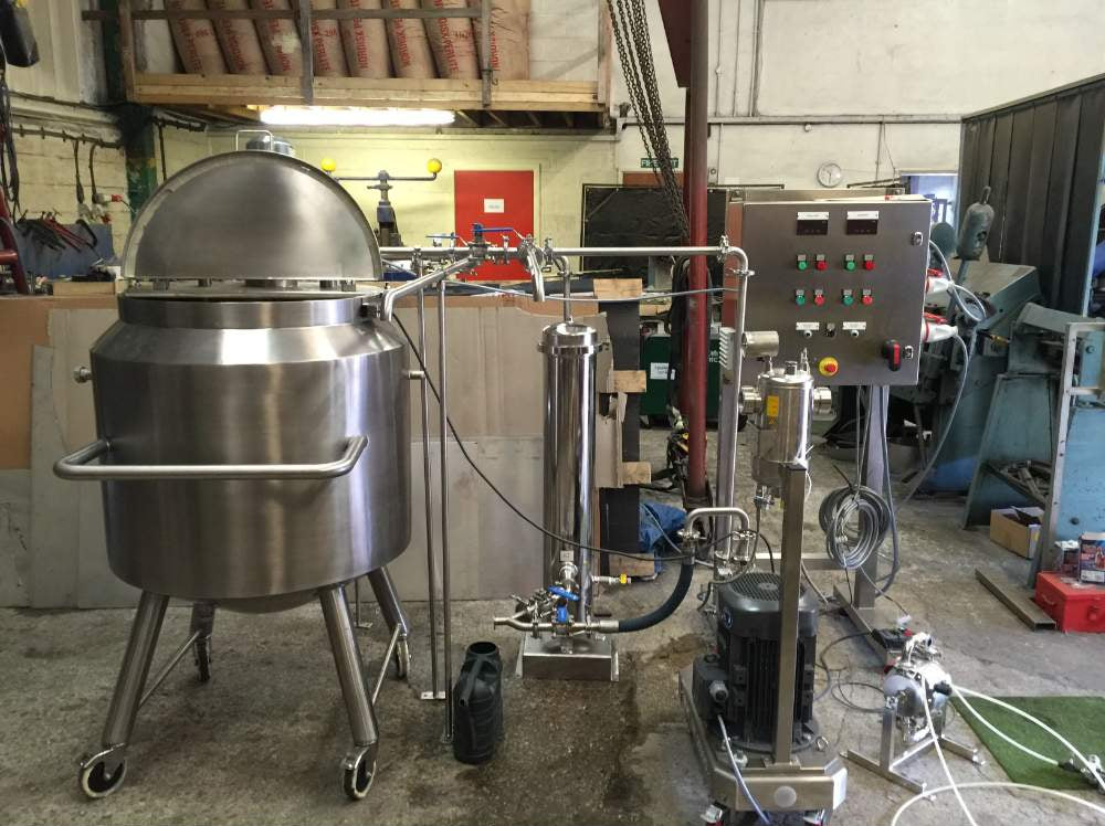 Salt of the Earth deodorant manufacturing equipment with stainless steel mixing tanks and control panel in factory setting